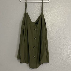 Army green shirt.